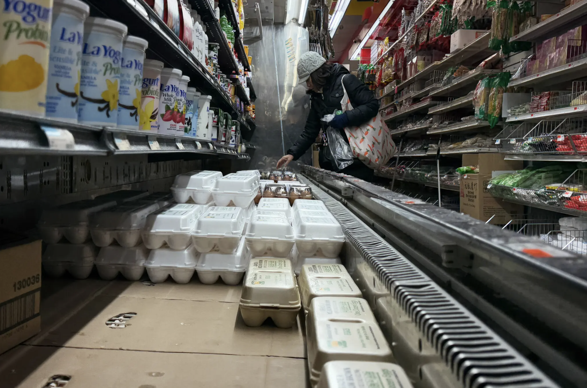 grocery shelves with very few egg cartons